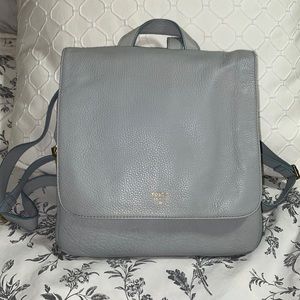 Fossil “Preston” leather backpack in a pale blue/grey color.